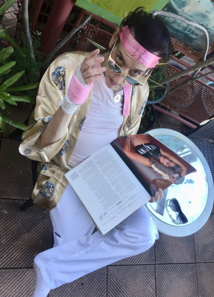 Lance Leopard reads yet Madonna book in the rooftop garden of his ivory tower.