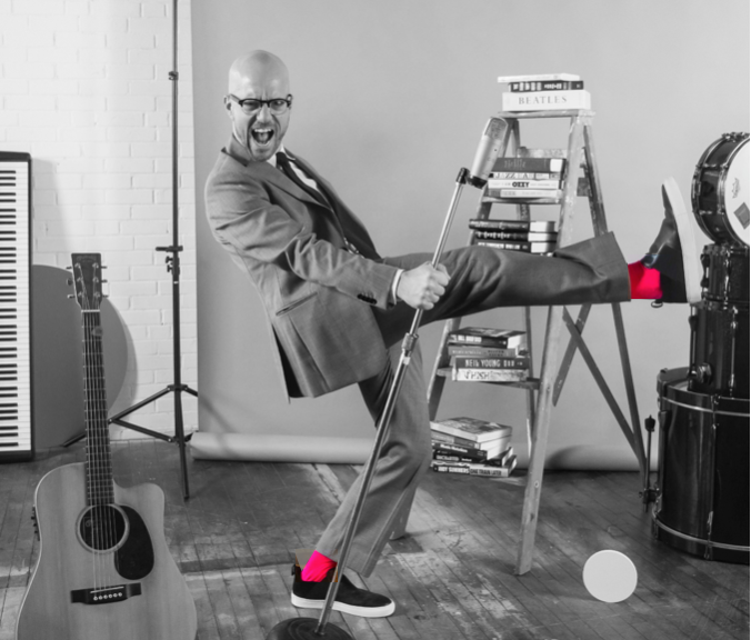 George Hrab dancing in music audio wearing pink socks.