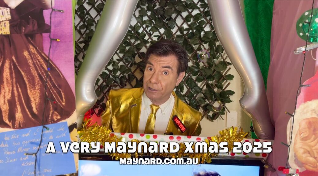 Maynard pops through his Xmas window