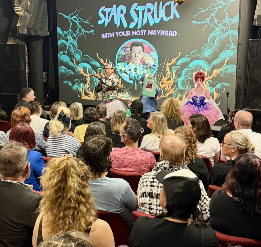 Maynard gestures towards Zak, who played guitar and sang in Starstruck.