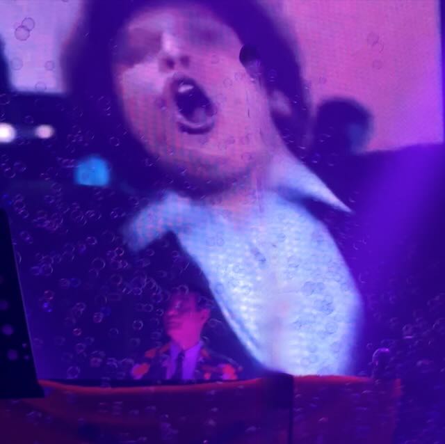 Maynard in front of Tom Jones video